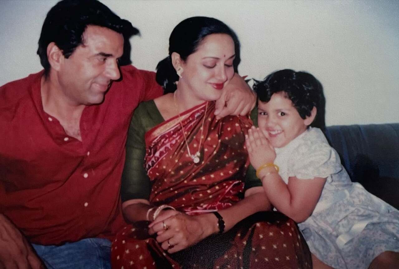 This picture was recently shared by Esha Deol to wish her dad on his birthday. The parents are seen adorably gazing at their little one, who is enjoying the moment.